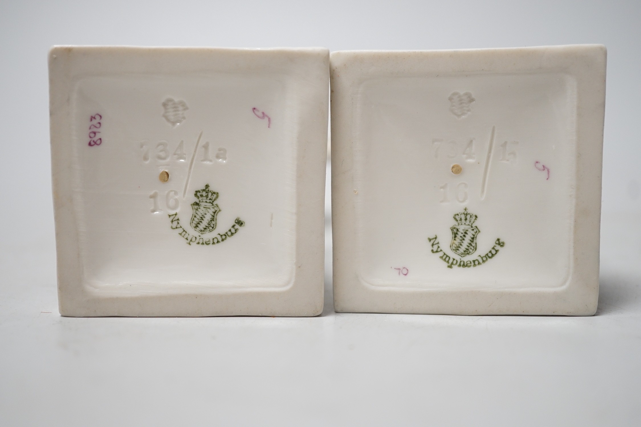 A pair of Nymphenburg urns, marked to base. 15.5cm tall